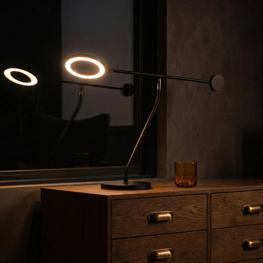 Arc Table Lamp modern curved silhouette casting warm amber glow