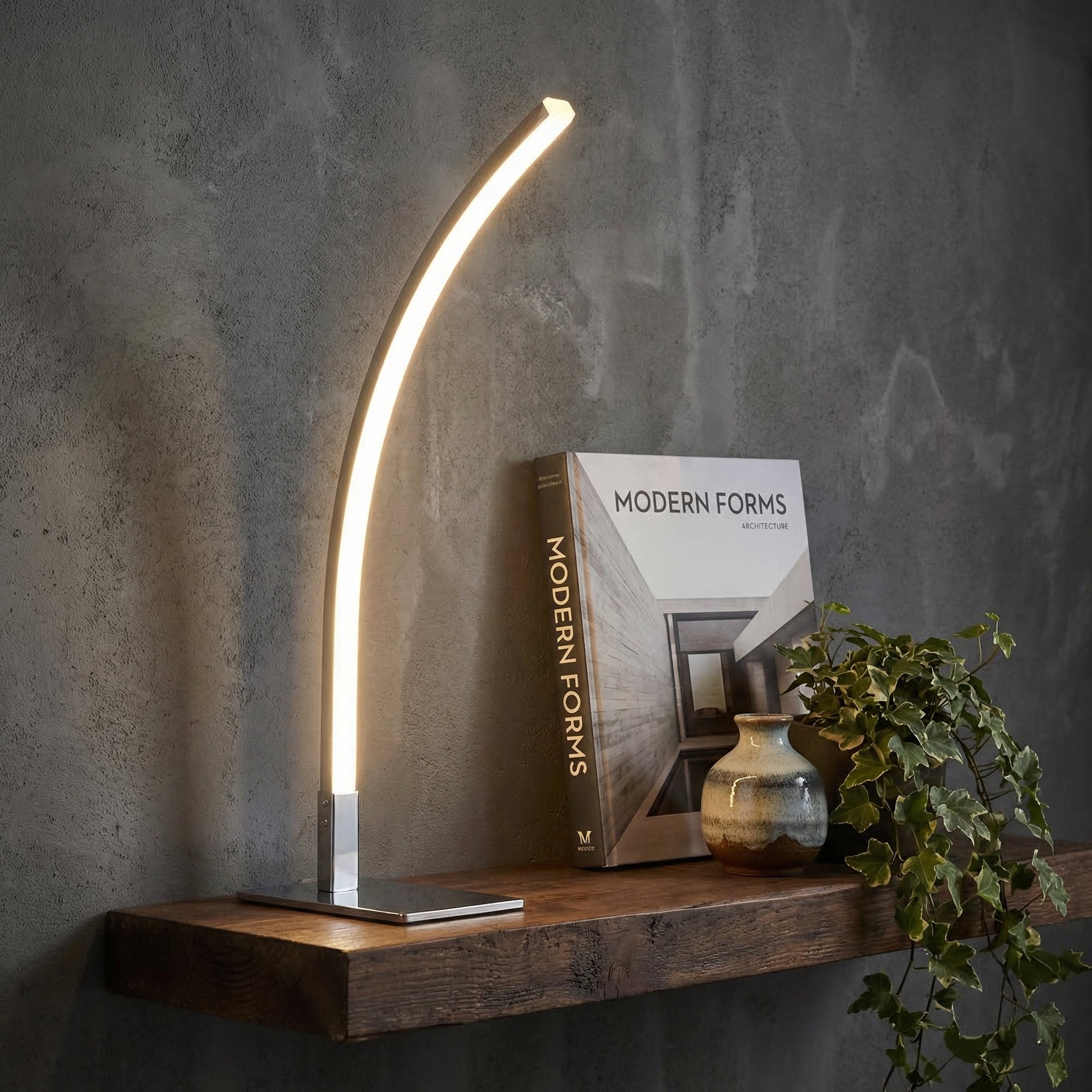 Crescent Table Lamp artistic sculptural form with warm amber lighting