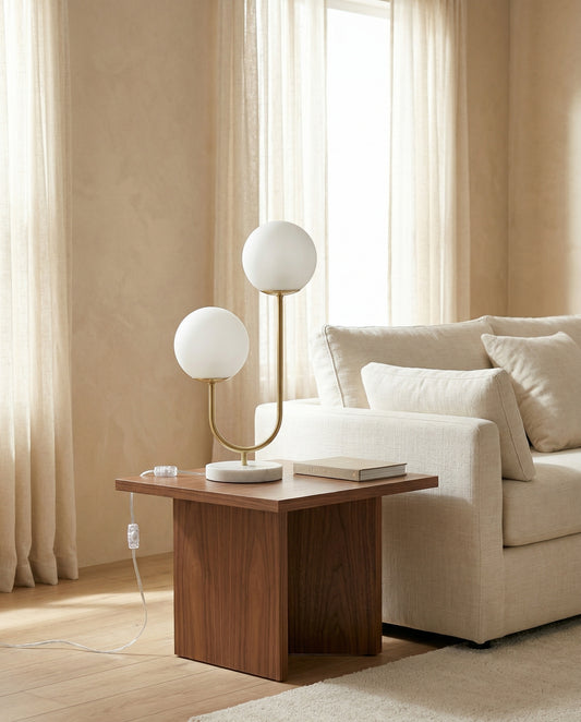 Duet Table Lamp twin glass globes casting warm amber light