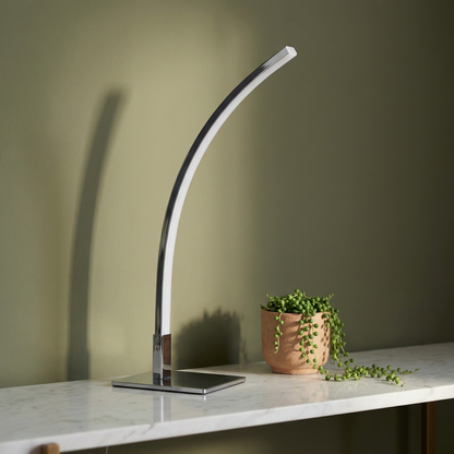 Dusklight Crescent moon lamp casting warm ambient glow on surface